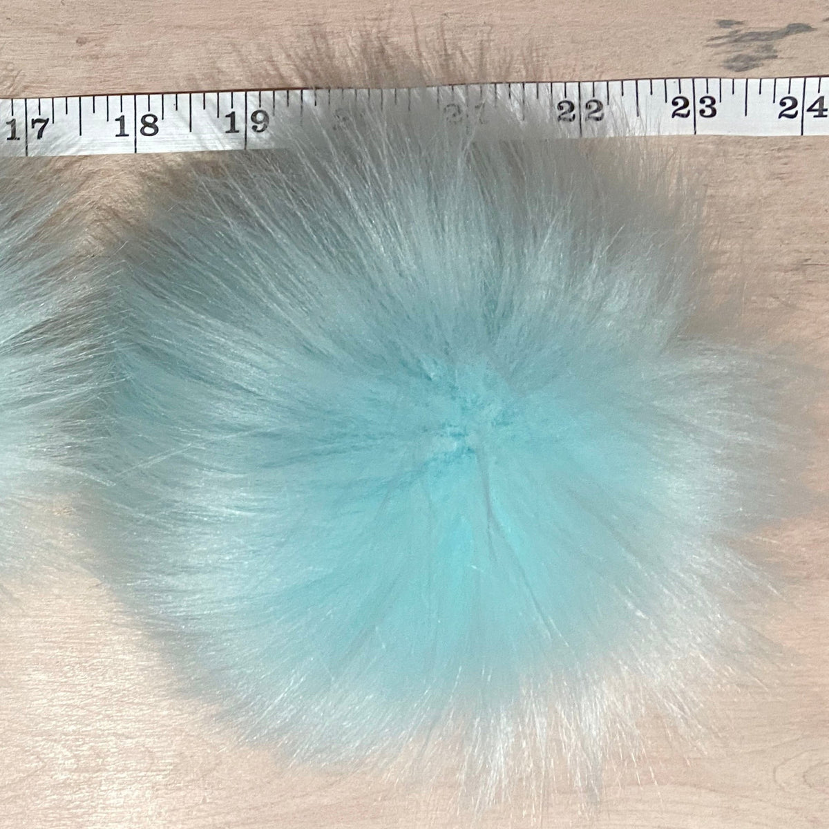 Faux Fur Pom Beside Tape Measurer